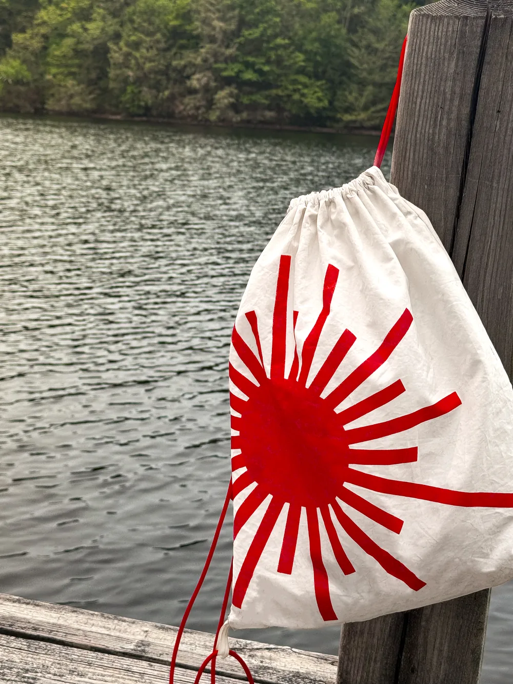 A finished Vela bag hanging on a dock